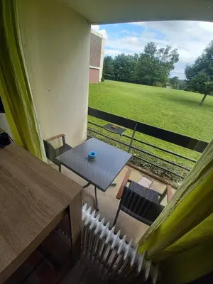 a view of a patio with a table and chairs at Ap76 Nature Ardennes Economy class apartment in La Calamine