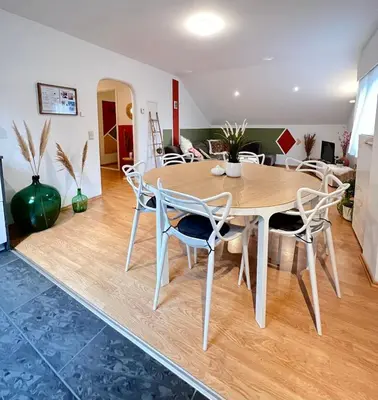 a dining room with a table and chairs at Au Natur'elle in Gemmenich