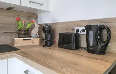 a kitchen counter with a coffee maker on a counter top at 1 Bedroom Lovely Apartment In Visé in Visé