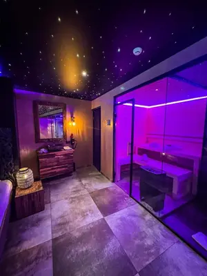 a purple bathroom with a tub and a sink at Clos des Thermes-Secret Garden in Liège