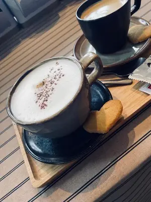 a tray with two cups of coffee on a table at Guesthouse 't Goed Leven in Stokrooie
