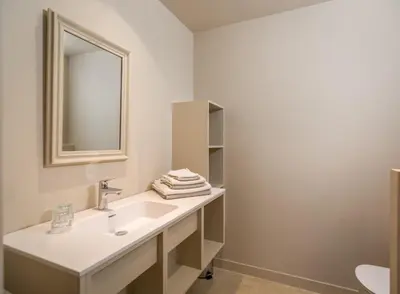 a bathroom with a sink and a mirror at Domein Marsnil in Heers