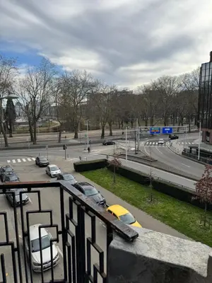 a view of a parking lot with cars in a city at Le 21 - Appart 3 chambres - centre de Liège in Liège
