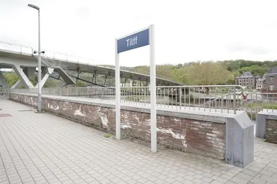 a street sign in front of a bridge at Gîte d'artiste, Riverside in Tilff