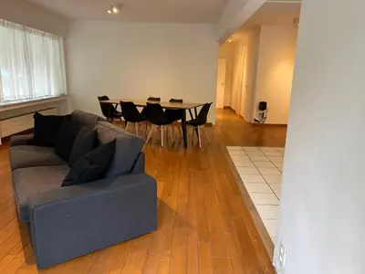 a living room with a couch and a table at Alexis's loft 2 in Liège