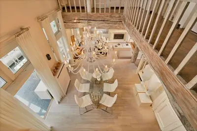 an overhead view of a dining room with a table and chairs at Luxe Vacation Villa with swimming pool, 5 bedrooms in Houthalen-Helchteren