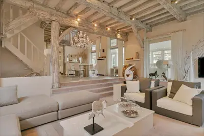 a living room with a couch and a table at Luxe Vacation Villa with swimming pool, 5 bedrooms in Houthalen-Helchteren