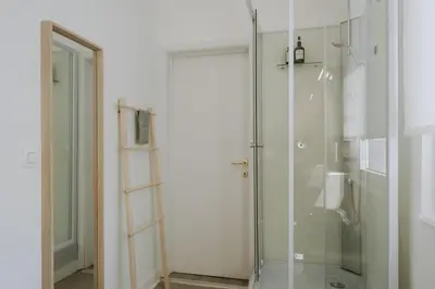 a shower with a glass door in a bathroom at 1 bedroom apartment in Liège center, Place du Marche - 3rd floor in Liège