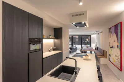a kitchen with a sink and a counter top at Borgraaf - Palazzio in Borgloon