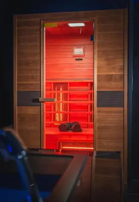 a room with a red door and a table at Loft Ardent in Liège