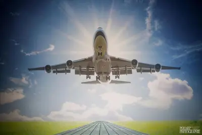 an airplane is taking off from an airport runway at Le Gate One in Herbesthal