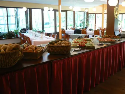 a buffet line with plates of food on it at Hotel De Watermolen in Bocholt