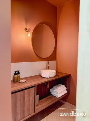 a bathroom with a sink and a mirror at Zandberg11 in Bree
