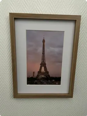 a picture of the eiffel tower in a frame at Tc home in Liège