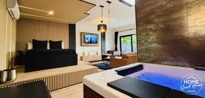 a living room with a tub in the middle of a room at Luxury Loft Home Sweet House in Oupeye
