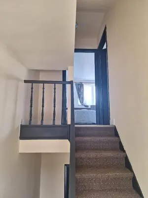 a staircase in a house with a window at Maison sympathique in Liège