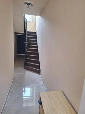 a staircase in a building with a stair case at Maison sympathique in Liège