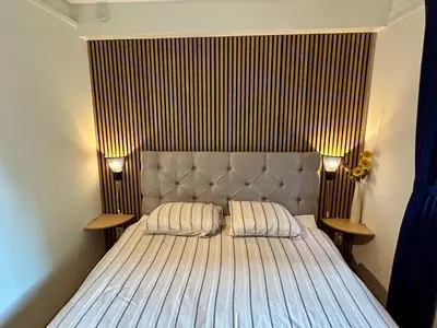 a bed with two pillows on it in a room at heerlijk vakantie huis Lovely holiday home in Lanaken