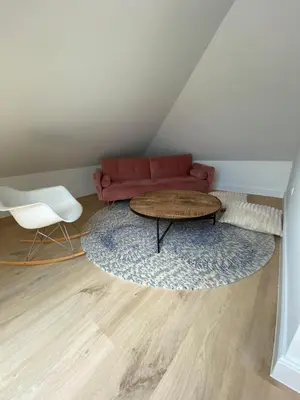a living room with a couch and a table at Cièlo in Tongeren