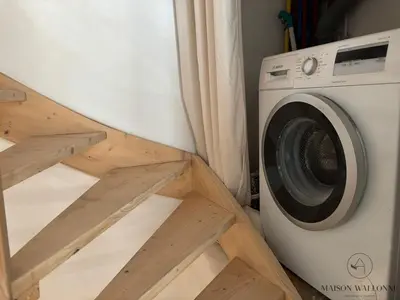 a washer and dryer sitting next to a washing machine at Petite maison typique en Outremeuse - 2 à 4 personnes in Liège