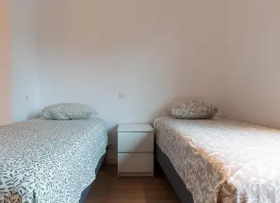 two beds sitting next to each other in a bedroom at Bocca in Hasselt