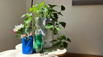 a vase with a plant in it on a table at 102 Cozy Neuvice in Liège