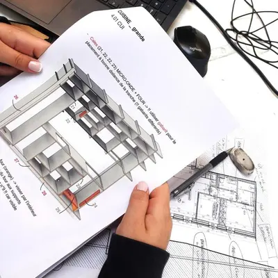 a person reading a drawing of a building at 303 Loft design Cathéderale in Liège