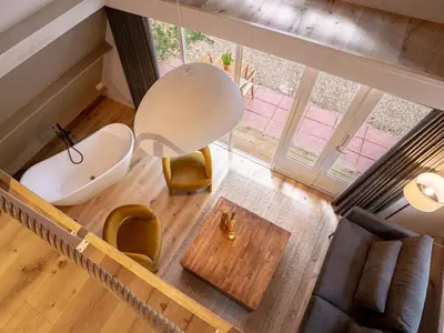 an overhead view of a living room with a table at Boshuisje Rekem - Plum in Lanaken