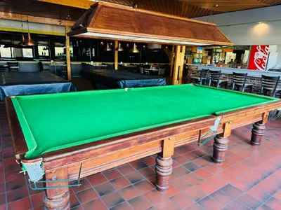 a green pool table sitting in a restaurant at Boshuisje June - middenin de natuur op een uurtje rijden van Antwerpen en Maastricht in Balen
