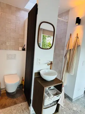 a bathroom with a sink and a mirror at GG'S studio in Hasselt