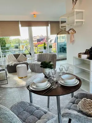 a living room with a table and chairs at GG'S studio in Hasselt
