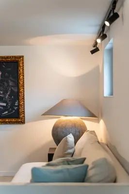 a lamp sitting on top of a bed in a room at Villa Weidezicht in Heusden - Zolder