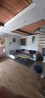 a large living room with couches and a table at Gîte 
