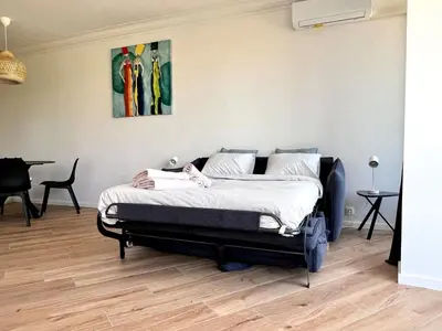 a bedroom with a large bed in a room at Cozy and fully equipped in the center of Liege 4 guests in Liège