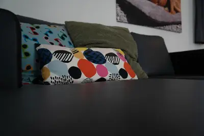 a couple of pillows sitting on top of a table at Camping Natuurlijk Limburg - Chalet 4 in Voeren