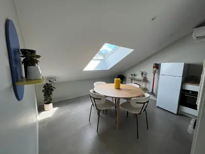 a kitchen with a table and chairs and a window at Studio SC - Cozy appartement in Genk near Thor Park - 4 people in Genk