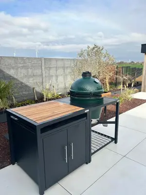 a grill with a green pot on top of a table at Inspire Residence and private Wellness in Tongeren