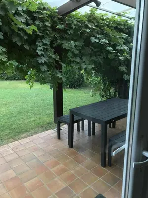 a black table and bench on a patio at Villa les Hauts de Heusy in Verviers