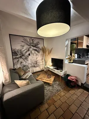 a living room with a couch and a table at Studio 94 in Welkenraedt