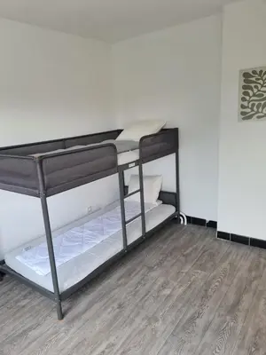 a room with a bunk bed in a room at Bianca's vakantiehuis in Houthalen-Helchteren