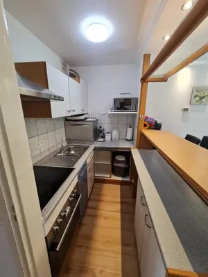 a kitchen with a sink and a stove top oven at Pause Nature N in La Calamine