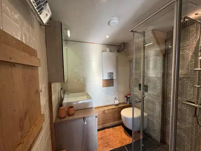 a bathroom with a toilet and a sink and a shower at Green Oak House in Dilsen-Stokkem