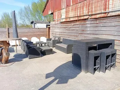 a group of benches sitting next to a building at Single-storey holiday home in Heers in Heers