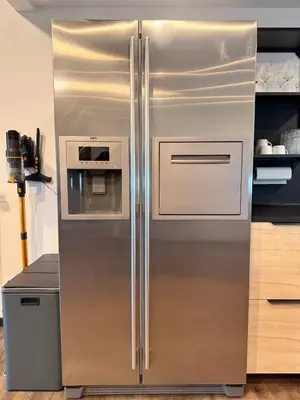 a stainless steel refrigerator in a kitchen at Elegance and sweetness of life in Liège in Liège