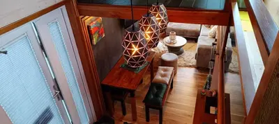 an overhead view of a table and chairs in a room at Tiny House Dreiländereck in La Calamine