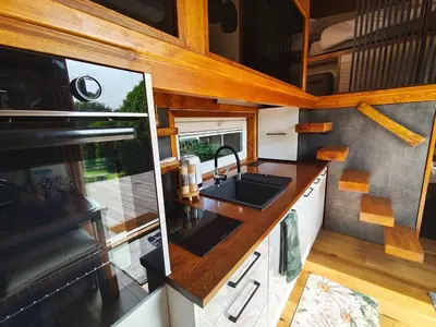 an interior view of a kitchen in a tiny house at Tiny House Dreiländereck in La Calamine