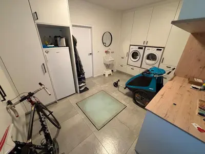 a kitchen with a bike parked in a room at Modern, child-friendly country house