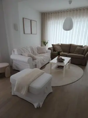 a living room with a couch and a table at Verliefd in Brustem in Sint-Truiden