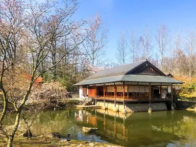 a building in the middle of a pond at Holiday home in the heart of Hasselt in Hasselt