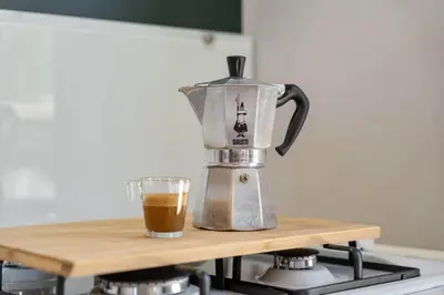 a coffee maker on a counter with a cup of coffee at Camping Papillon Kinrooi - La Casetta in Kinrooi
